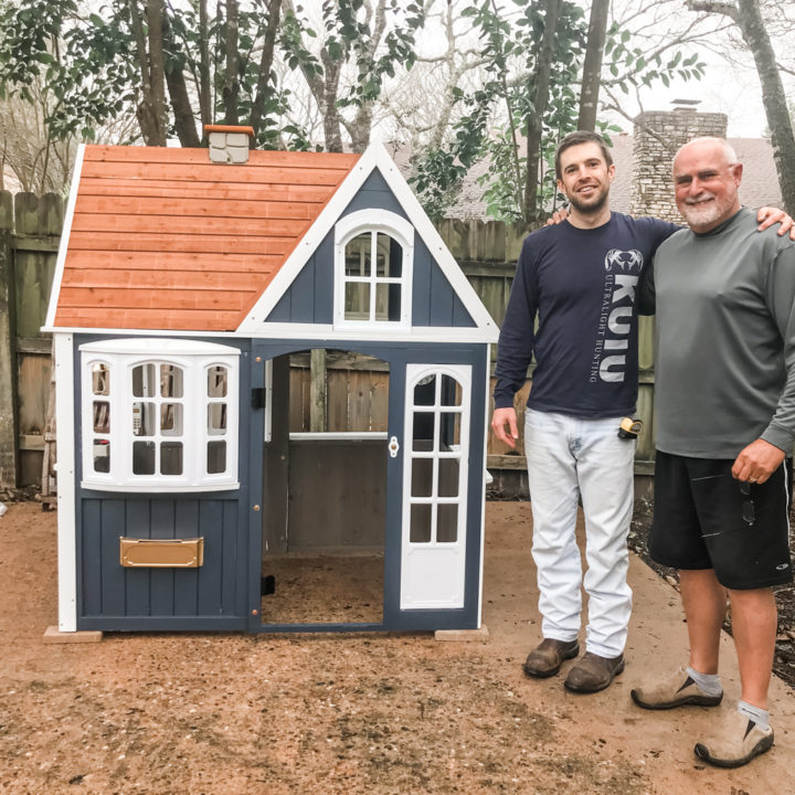 My dad and Andrew posing in front of the (almost) complete playhouse