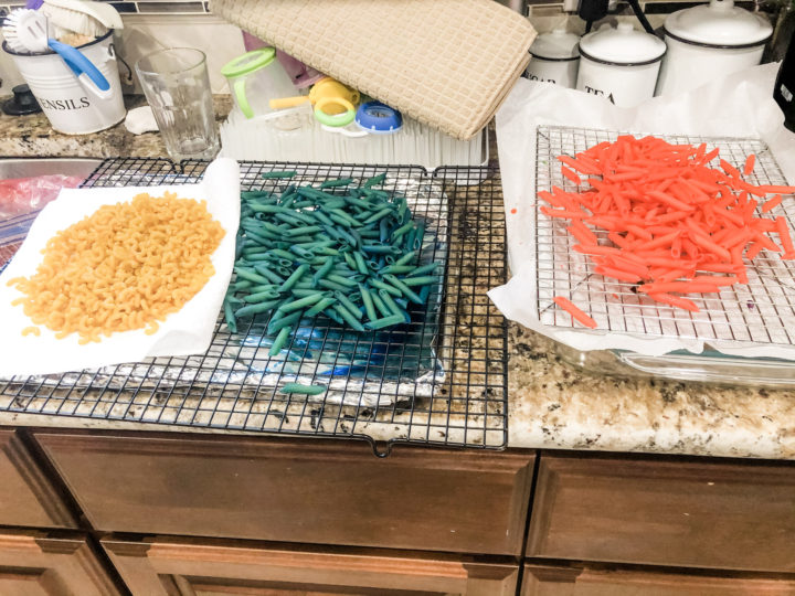 Rainbow dyed pasta drying on cooling racks on my kitchen counter